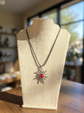 Silver sun with carnelian stone