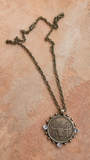 Longhorn coin pendant